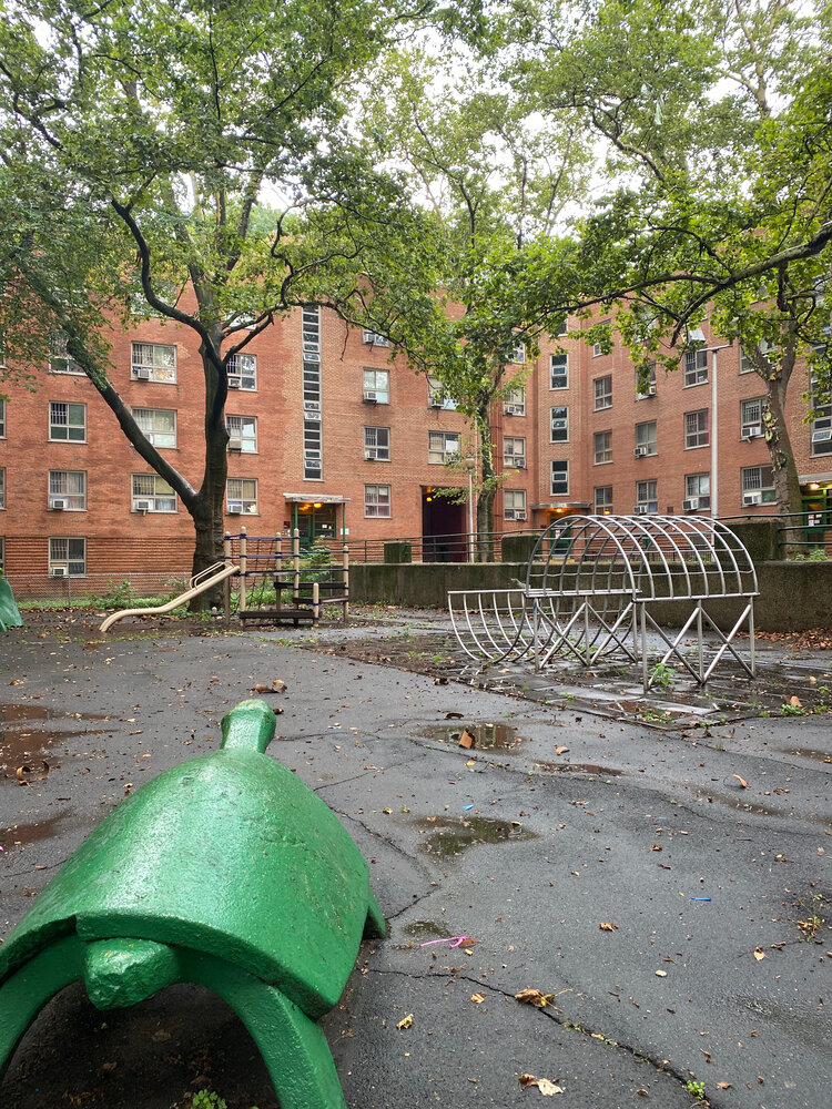 A courtyard and sunken playground at the Harlem River Houses